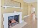 Fireplace with decorative tile and wood mantle at 2425 Riverview Blvd, Bradenton, FL 34205
