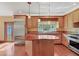 Updated kitchen, island, wood floors and breakfast bar at 2425 Riverview Blvd, Bradenton, FL 34205