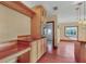 Kitchen wet bar with wood cabinetry and sink at 2425 Riverview Blvd, Bradenton, FL 34205