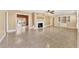 Spacious living room with fireplace and terrazzo floors at 2425 Riverview Blvd, Bradenton, FL 34205