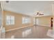 Spacious living area with light walls and ceiling fan at 2425 Riverview Blvd, Bradenton, FL 34205