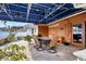 Covered patio with table and chairs, adjacent to the house at 2425 Riverview Blvd, Bradenton, FL 34205