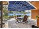 Covered patio with seating area and a view of the pool at 2425 Riverview Blvd, Bradenton, FL 34205