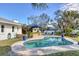 Inviting kidney-shaped pool surrounded by lush landscaping at 2425 Riverview Blvd, Bradenton, FL 34205