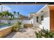 Relaxing pool area with stone wall and patio at 2425 Riverview Blvd, Bradenton, FL 34205