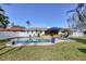 Backyard oasis featuring a kidney-shaped pool and patio at 2425 Riverview Blvd, Bradenton, FL 34205