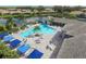 Community pool with surrounding lounge chairs at 2616 Sapphire Blue Ln, Bradenton, FL 34211