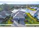 Luxury home with lake view, two-car garage, and paver driveway at 2616 Sapphire Blue Ln, Bradenton, FL 34211