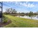 Peaceful backyard with pond view and lush landscaping at 2616 Sapphire Blue Ln, Bradenton, FL 34211