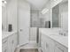 Elegant bathroom with double vanity, large shower, and marble flooring at 2616 Sapphire Blue Ln, Bradenton, FL 34211
