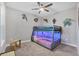 bedroom with bunk beds, superhero decor, and soft carpet at 2616 Sapphire Blue Ln, Bradenton, FL 34211