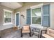 Relaxing front porch with blue shutters and comfortable seating at 2616 Sapphire Blue Ln, Bradenton, FL 34211