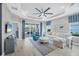 Bright and airy living room with vaulted ceiling, comfortable seating, and water views at 2616 Sapphire Blue Ln, Bradenton, FL 34211