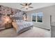 Main bedroom with floral accent wall and large window at 2616 Sapphire Blue Ln, Bradenton, FL 34211