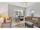 Bright home office features a comfortable couch and workspace at 2616 Sapphire Blue Ln, Bradenton, FL 34211