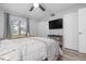 Bedroom with queen bed, TV, and ample closet space at 2744 Hidden Lake Blvd # A, Sarasota, FL 34237