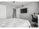 Bedroom with a queen bed and built-in TV at 2744 Hidden Lake Blvd # A, Sarasota, FL 34237