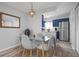 Dining area with glass table and gray chairs at 2744 Hidden Lake Blvd # A, Sarasota, FL 34237