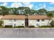 Two-story condo building with parking and lush landscaping at 2744 Hidden Lake Blvd # A, Sarasota, FL 34237