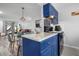 Modern kitchen with granite countertops and blue cabinetry at 2744 Hidden Lake Blvd # A, Sarasota, FL 34237