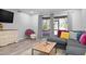 L-shaped sectional sofa,sliding glass doors, wood floor at 2744 Hidden Lake Blvd # A, Sarasota, FL 34237