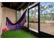 Relaxing screened patio with purple hammock at 2744 Hidden Lake Blvd # A, Sarasota, FL 34237