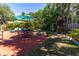 Outdoor patio with brick pavers, seating area, and umbrella at 321 27Th W St, Bradenton, FL 34205