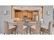 Community kitchen with granite counters, stainless steel appliances, and wicker barstools at 3430 77Th W St # 102, Bradenton, FL 34209