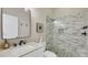 Modern bathroom featuring a frameless shower and marble tile at 3484 Hadfield Greene # 22, Sarasota, FL 34235
