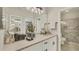 Elegant bathroom with marble finishes and double vanity at 3484 Hadfield Greene # 22, Sarasota, FL 34235