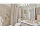 Clean bathroom with shower/tub combo and updated vanity at 3484 Hadfield Greene # 22, Sarasota, FL 34235
