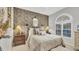 Cozy bedroom with unique wallpaper and ample closet space at 3484 Hadfield Greene # 22, Sarasota, FL 34235