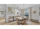 Charming dining room with hardwood floors and an adjacent kitchen at 3484 Hadfield Greene # 22, Sarasota, FL 34235