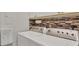 Convenient laundry room with side-by-side washer and dryer at 3484 Hadfield Greene # 22, Sarasota, FL 34235