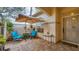Cozy patio with a table, chairs, and umbrella, perfect for relaxing at 3484 Hadfield Greene # 22, Sarasota, FL 34235