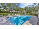 Inviting community pool with lounge chairs at 3484 Hadfield Greene # 22, Sarasota, FL 34235