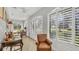 Relaxing sunroom with plenty of natural light and custom window treatments at 3484 Hadfield Greene # 22, Sarasota, FL 34235