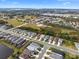 Aerial view of neighborhood with pond at 3543 Woodmont Dr, Parrish, FL 34219