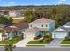 Two-story house with attached garage, landscaping, and American flag at 3543 Woodmont Dr, Parrish, FL 34219