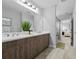 Main bathroom with double vanity and shower at 3543 Woodmont Dr, Parrish, FL 34219