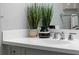 Modern bathroom sink vanity with gray cabinets and white countertop at 3543 Woodmont Dr, Parrish, FL 34219