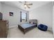 Bedroom with ceiling fan, dresser, and beanbag chair at 3543 Woodmont Dr, Parrish, FL 34219