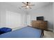 Bedroom with ceiling fan and double door closet at 3543 Woodmont Dr, Parrish, FL 34219