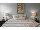 Main bedroom with a king-size bed and neutral decor at 3543 Woodmont Dr, Parrish, FL 34219