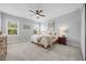 Spacious bedroom with carpeted floor and large windows at 3543 Woodmont Dr, Parrish, FL 34219