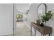 Entryway with console table, mirror, and view of living room at 3543 Woodmont Dr, Parrish, FL 34219