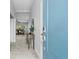 Bright entryway with light tile floors and a view into the living room at 3543 Woodmont Dr, Parrish, FL 34219