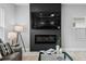 Modern fireplace with built-in TV and gray shiplap surround at 3543 Woodmont Dr, Parrish, FL 34219