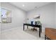 Bright home office with a large desk, comfortable chair and natural light at 3543 Woodmont Dr, Parrish, FL 34219