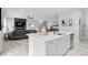 Open kitchen with island, view of living room, and modern finishes at 3543 Woodmont Dr, Parrish, FL 34219